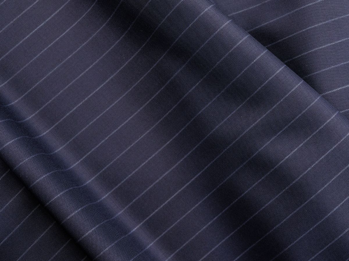 Navy pinstripe suiting fabric with elegant drape